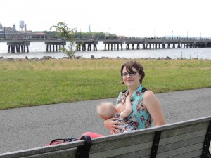 One of our NJ mommas nursing in public with Liberty Island in the background.